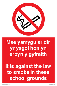 Mae ysmygu ar dir yr ysgol hon yn erbyn y gyfraith It is against the law to smoke in these school grounds - Bilingual Welsh / English